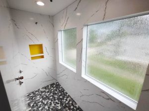 ESF installed Cambria brand Hanstone Calcatta Extra Quartz in a bathroom shower remodel project in Lisbon, Iowa