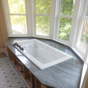 ESF installed this stone encasement for this rustic bathroom makeover