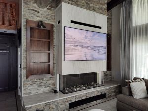 Collaborative product surfaces in the luxurious family room showcasing the fireplace